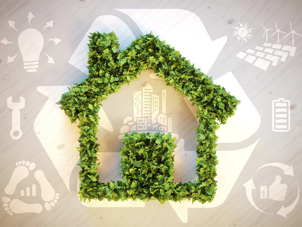 Biomaterialien Recycling Bildbeschreibung / description: Grünes Blätterhaus auf Holzhintergrund, inklusive diverser Nachhaltigkeitssymbole